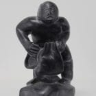 Wonderful carving of a man dressing by an unknown Inuit artist