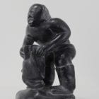 Wonderful carving of a man dressing by an unknown Inuit artist