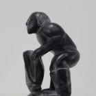 Wonderful carving of a man dressing by an unknown Inuit artist