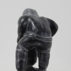 Wonderful carving of a man dressing by an unknown Inuit artist