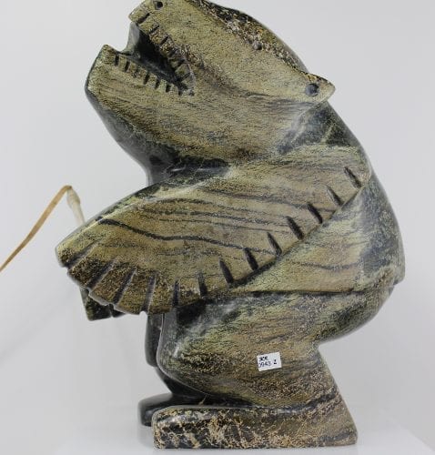 Striking carving called Shaman and Spirits by Palaya Qiatsuq, an Inuit artist from Cape Dorset