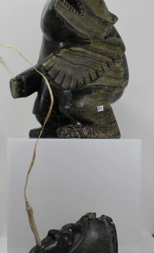 Striking carving called Shaman and Spirits by Palaya Qiatsuq, an Inuit artist from Cape Dorset