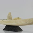 Ivory hunter and kayak carved by an unknown Inuit artist. Thought to be from Pangnirtung.