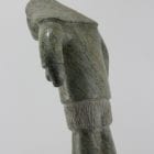 Man carved from beautiful stone by Inuit artist Ineak Padluq, an artist from Lake Harbour