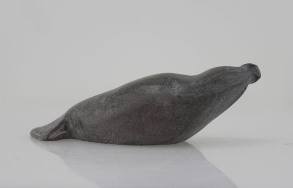 Grey seal carved by Sanikiluaq artist Johnassie Uppik.