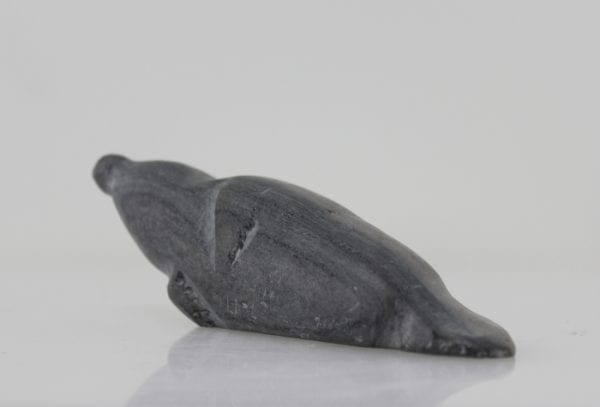 Grey seal carved by Sanikiluaq artist Johnassie Uppik.