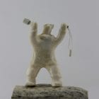 Shaman Bear by Louie Makkituq is a phenomenal carving in cream stone. A striking piece.