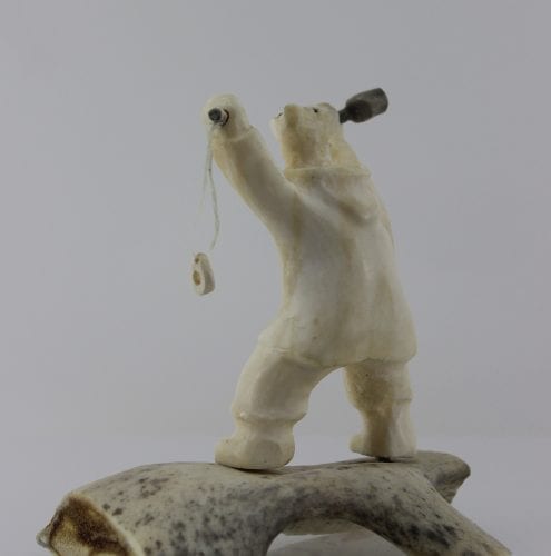 Shaman Bear by Louie Makkituq is a phenomenal carving in cream stone. A striking piece.