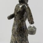 Wonderful carving of a woman with a pail of eggs, carved by Pitseolak Qimirpik