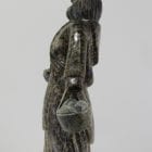 Wonderful carving of a woman with a pail of eggs, carved by Pitseolak Qimirpik