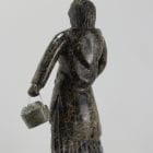 Wonderful carving of a woman with a pail of eggs, carved by Pitseolak Qimirpik