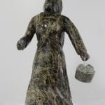 Wonderful carving of a woman with a pail of eggs, carved by Pitseolak Qimirpik