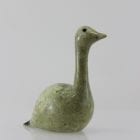 Beautiful green bird with elegant lines carved by Mark Pitsiulak, an artist from Kimmirut.