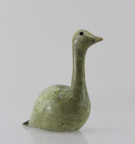 Beautiful green bird with elegant lines carved by Mark Pitsiulak, an artist from Kimmirut.