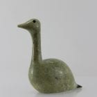 Beautiful green bird with elegant lines carved by Mark Pitsiulak, an artist from Kimmirut.