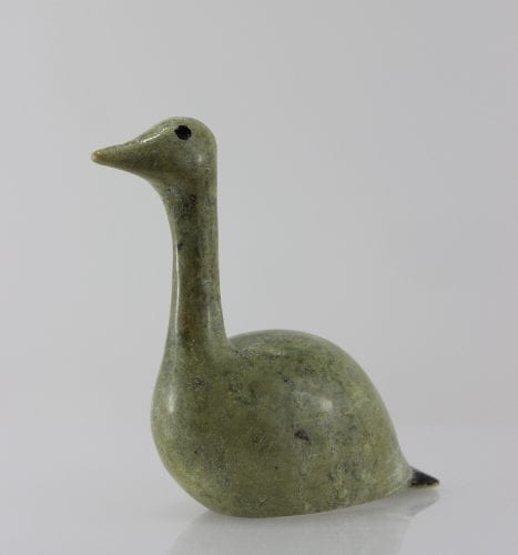 Beautiful green bird with elegant lines carved by Mark Pitsiulak, an artist from Kimmirut.
