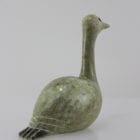 Beautiful green bird with elegant lines carved by Mark Pitsiulak, an artist from Kimmirut.