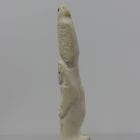 Ivory totem carved by Alexis Milortok, an Inuit artist from Naujaat, Nunavut.