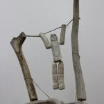antler bone carving of Swinging Man by Thomas Aniksak from Arviat