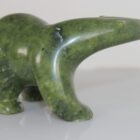 Green serpentine Walking Bear by Quaraq Nungusuituq (ᑯᐊᕋ ᑭᒐᐃ) from Cape Dorset